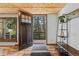 Welcoming home entrance featuring a wooden door and stylish decor at 55 Two Moon Rd, Idaho Springs, CO 80452