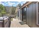 Inviting entrance with stylish door, warm lighting and mountain views at 55 Two Moon Rd, Idaho Springs, CO 80452