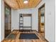 Warm entryway with wooden accents, storage, and natural light at 55 Two Moon Rd, Idaho Springs, CO 80452