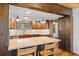 Spacious kitchen featuring granite countertops, wood cabinets, chalkboard, and stainless steel appliances at 55 Two Moon Rd, Idaho Springs, CO 80452