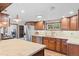 Bright kitchen featuring granite countertops, stainless steel appliances, and warm cabinetry at 55 Two Moon Rd, Idaho Springs, CO 80452