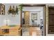 Living room entryway showcases open design with stone fireplace, wooden beams, and warm natural light at 55 Two Moon Rd, Idaho Springs, CO 80452