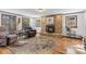 Cozy living room featuring stone fireplace, comfortable seating, and plenty of natural light at 55 Two Moon Rd, Idaho Springs, CO 80452