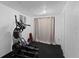 Finished basement with exercise equipment and textured walls at 1245 Garfield St, Denver, CO 80206