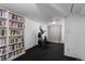Finished basement with exercise equipment and storage bookshelves at 1245 Garfield St, Denver, CO 80206