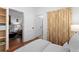 Bright bedroom with hardwood floors, white walls, and stylish floral curtains at 1245 Garfield St, Denver, CO 80206