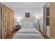 Cozy bedroom with hardwood floors, a neutral color scheme, and soft natural lighting at 1245 Garfield St, Denver, CO 80206