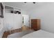 Bright bedroom with hardwood floors and built-in storage features a calming color palette at 1245 Garfield St, Denver, CO 80206