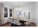 Contemporary dining room featuring a modern light fixture, hardwood floors, and ample natural light at 1245 Garfield St, Denver, CO 80206