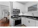 Well-equipped kitchen with stainless steel appliances, granite countertops, and white cabinetry at 1245 Garfield St, Denver, CO 80206