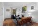 Bright living room with a fireplace, hardwood floors, and comfortable seating, illuminated by natural light at 1245 Garfield St, Denver, CO 80206