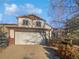 Charming two-story home featuring a two-car garage, classic design and well-maintained landscaping at 10020 Strathfield Ln, Highlands Ranch, CO 80126