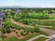 Scenic aerial view of the property and its surroundings, highlighting the lush greenery, walking path, and proximity to nature at 14823 W 70Th Dr # A, Arvada, CO 80007