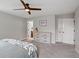 Bedroom with neutral walls, minimalist decor, and an ensuite bathroom at 14823 W 70Th Dr # A, Arvada, CO 80007