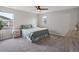 Comfortable bedroom with natural light, ceiling fan, and minimalist decor at 14823 W 70Th Dr # A, Arvada, CO 80007