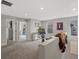 Bonus room boasts neutral carpeting, recessed lighting, and multiple doorways and windows at 14823 W 70Th Dr # A, Arvada, CO 80007