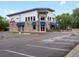 Exterior of a commercial building with stone facade, awnings, and accessible parking at 14823 W 70Th Dr # A, Arvada, CO 80007