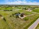 Sprawling equestrian estate features lush pastures, fenced paddocks, and charming farmhouse with red barn, set against a beautiful landscape at 41504 Vista Ridge, Parker, CO 80138