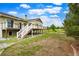 Wide view of the backyard with deck and stairs at 41504 Vista Ridge, Parker, CO 80138