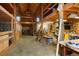 Spacious barn interior with wooden beams, workshop area, and stalls at 41504 Vista Ridge, Parker, CO 80138