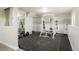 Finished basement gym featuring a weight rack and mirror for fitness enthusiasts at 41504 Vista Ridge, Parker, CO 80138