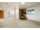 Cozy basement featuring a stone-accented fireplace and plush carpeting for ultimate comfort and relaxation at 41504 Vista Ridge, Parker, CO 80138