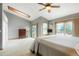 Bright main bedroom features a ceiling fan, natural light, and access to an outdoor balcony at 41504 Vista Ridge, Parker, CO 80138