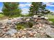 Beautiful rock feature and pond in the backyard at 41504 Vista Ridge, Parker, CO 80138
