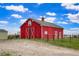 Lovely red barn with large doors and accents. Partially fenced yard at 41504 Vista Ridge, Parker, CO 80138