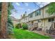 Back exterior of the property with patio and green space at 6880 E Appleton Cir, Centennial, CO 80112