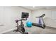 Finished basement offers a home gym area with treadmill, bike, and fitness accessories at 6880 E Appleton Cir, Centennial, CO 80112