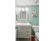 Bathroom features a single sink vanity, toilet, neutral paint, and decor at 6880 E Appleton Cir, Centennial, CO 80112