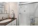 Bright bathroom features a glass-enclosed shower and modern fixtures at 6880 E Appleton Cir, Centennial, CO 80112