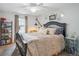 Cozy bedroom with a stylish bed and soft, neutral tones at 6880 E Appleton Cir, Centennial, CO 80112