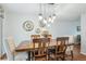 Well-lit dining room with a wooden table, stylish decor, and plenty of space for entertaining at 6880 E Appleton Cir, Centennial, CO 80112