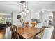 Dining room featuring a wooden table, view to the kitchen and comfortable seating for Gathering dining at 6880 E Appleton Cir, Centennial, CO 80112