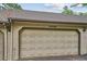 Attached two-car garage with unit number at 6880 E Appleton Cir, Centennial, CO 80112