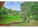 Beautiful, well-maintained community green space with mature trees and creek at 6880 E Appleton Cir, Centennial, CO 80112