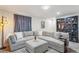 Relaxing living room showcases a plush sectional and custom shelving at 6880 E Appleton Cir, Centennial, CO 80112