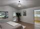 Light and airy bedroom with hardwood floors and ensuite bathroom at 1896 S Marshall Cir, Lakewood, CO 80232