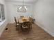 Clean dining room with hardwood floors and modern lighting at 1896 S Marshall Cir, Lakewood, CO 80232