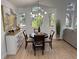 Cozy dining area with hardwood floors and natural light streaming through multiple windows at 1896 S Marshall Cir, Lakewood, CO 80232