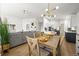 Elegant dining room with hardwood floors, modern lighting, and a comfortable seating area at 1896 S Marshall Cir, Lakewood, CO 80232