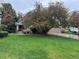 Charming home with well-maintained lawn and mature tree at 1896 S Marshall Cir, Lakewood, CO 80232