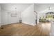 Open-concept living area with hardwood floors, bright lighting, and large windows offering natural light at 1896 S Marshall Cir, Lakewood, CO 80232