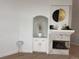 Bright living room with hardwood floors, built in nook and fireplace at 1896 S Marshall Cir, Lakewood, CO 80232