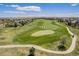 Scenic aerial view of a well-manicured golf course surrounded by residential homes in a beautiful community at 26004 E Elmhurst Pl, Aurora, CO 80016