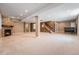 Spacious finished basement featuring plush carpeting and a stone fireplace at 26004 E Elmhurst Pl, Aurora, CO 80016