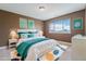 Bedroom with a large window, comfortable bed and stylish accents at 26004 E Elmhurst Pl, Aurora, CO 80016