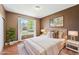 Cozy staged bedroom with neutral tones, bright natural light, and tasteful decor to create a peaceful retreat at 26004 E Elmhurst Pl, Aurora, CO 80016